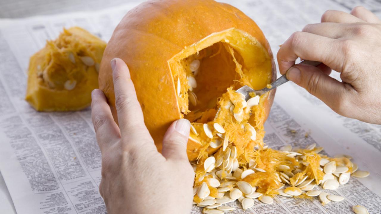Carved pumpkin on newspaper
