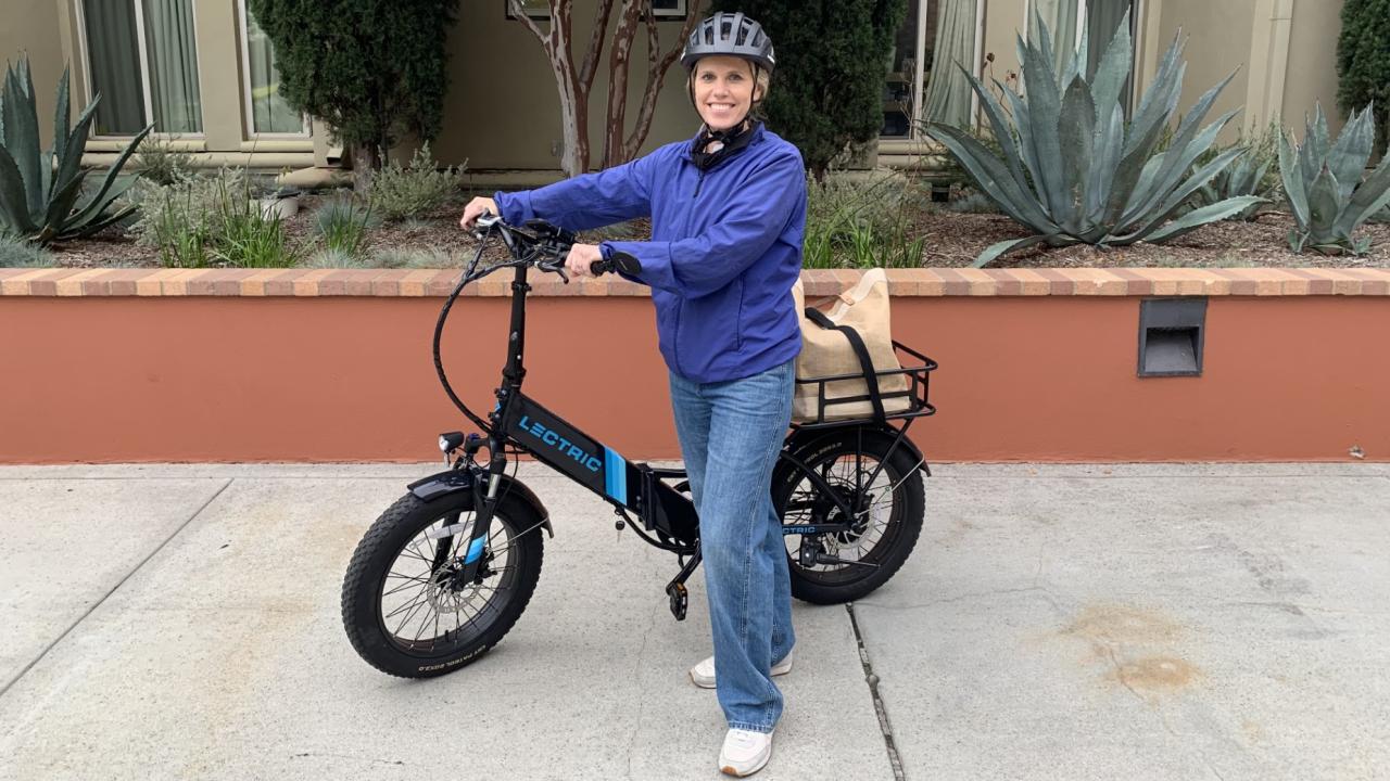 Magyn Kydd, senior director at UCLA Administration Marketing & Communications, with the e-bike she uses to commute to campus.