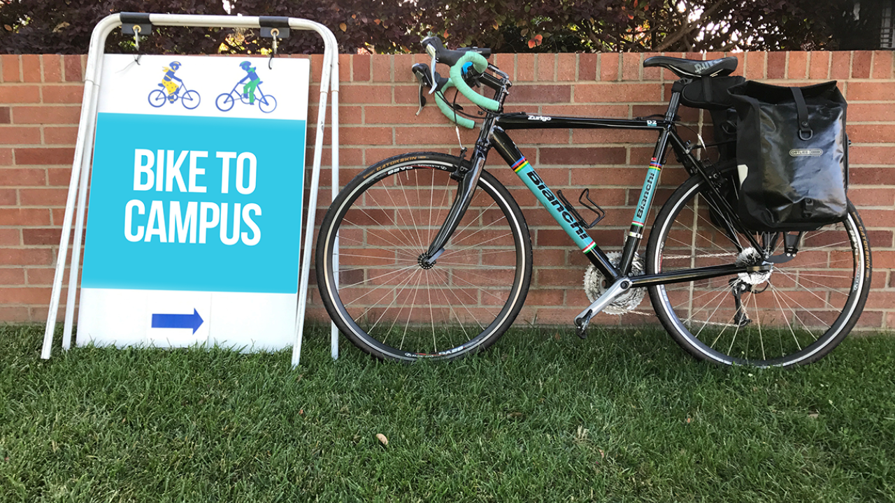 Bike to campus sign and bicycle