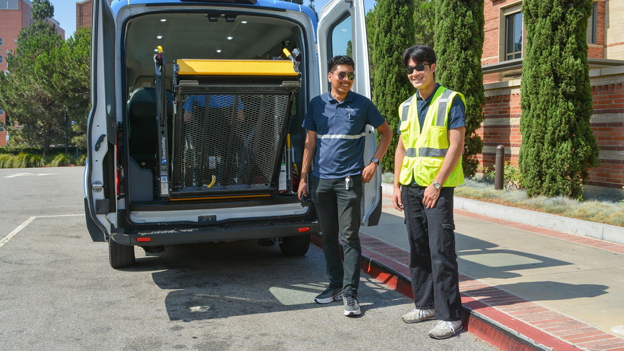 BruinAccess student employees operating wheelchair ramp