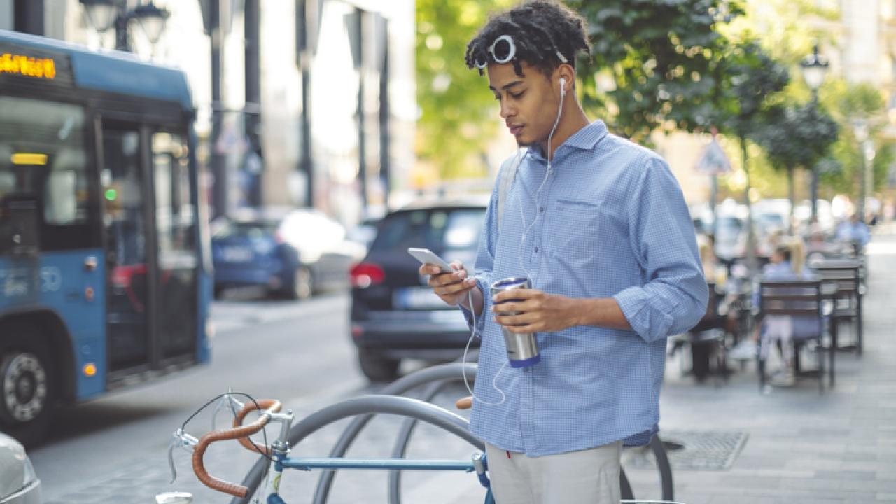 Bike rider looking at his phone.