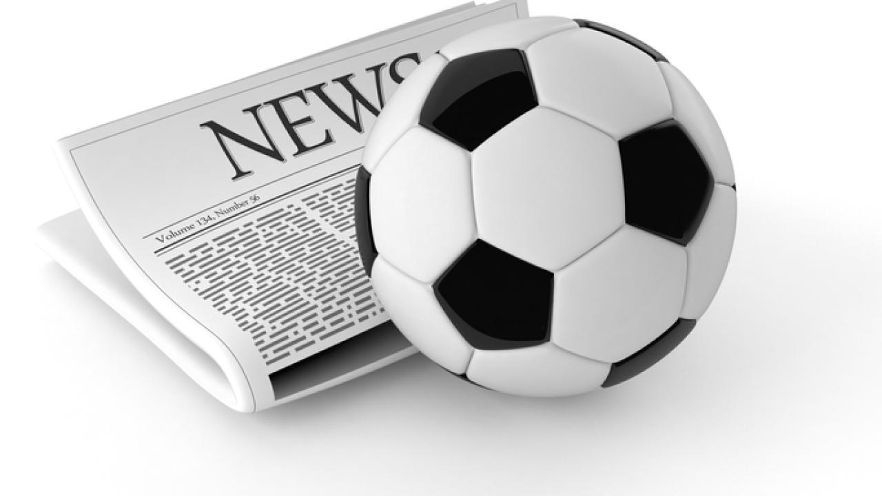 Newspaper with a soccer ball