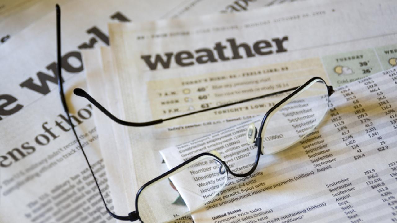 Newspaper and glasses