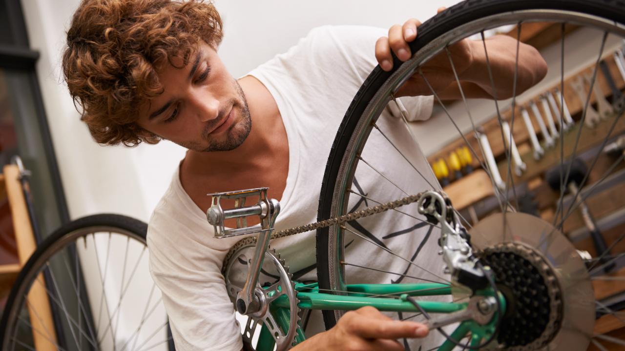 Man repairing a bicycle tire