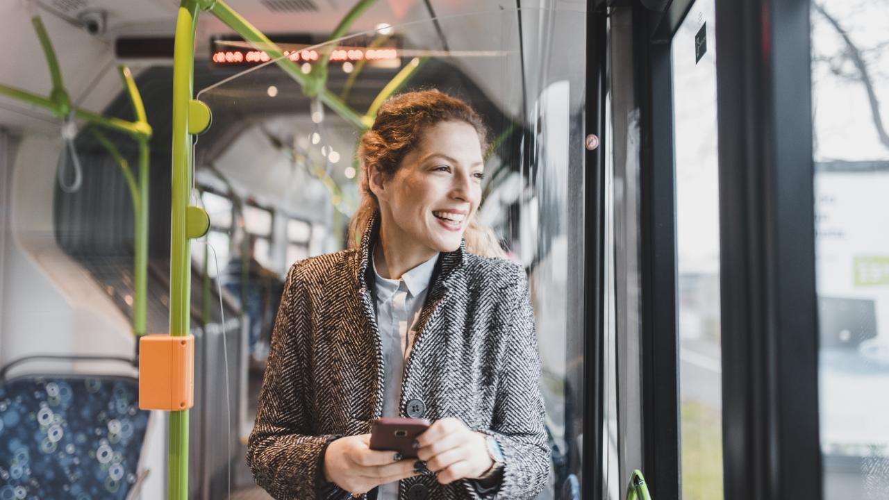 Woman on train with phone