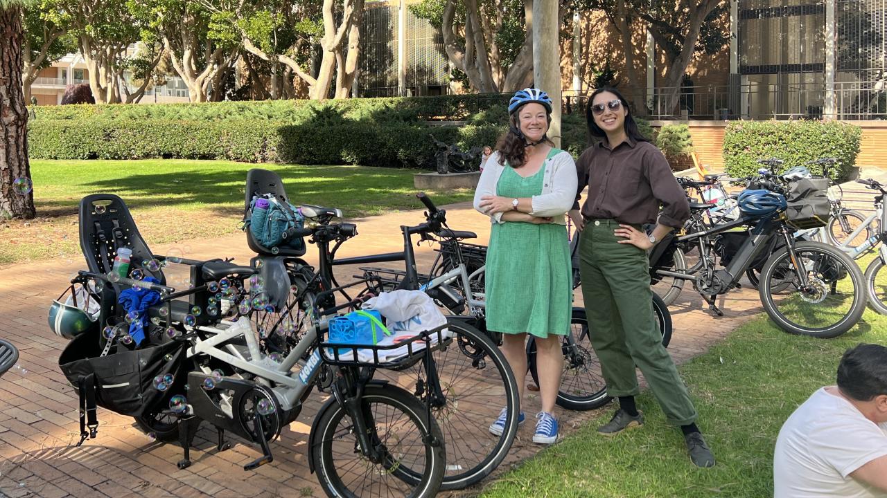 Two happy e-bike riders in north campus at UCLA