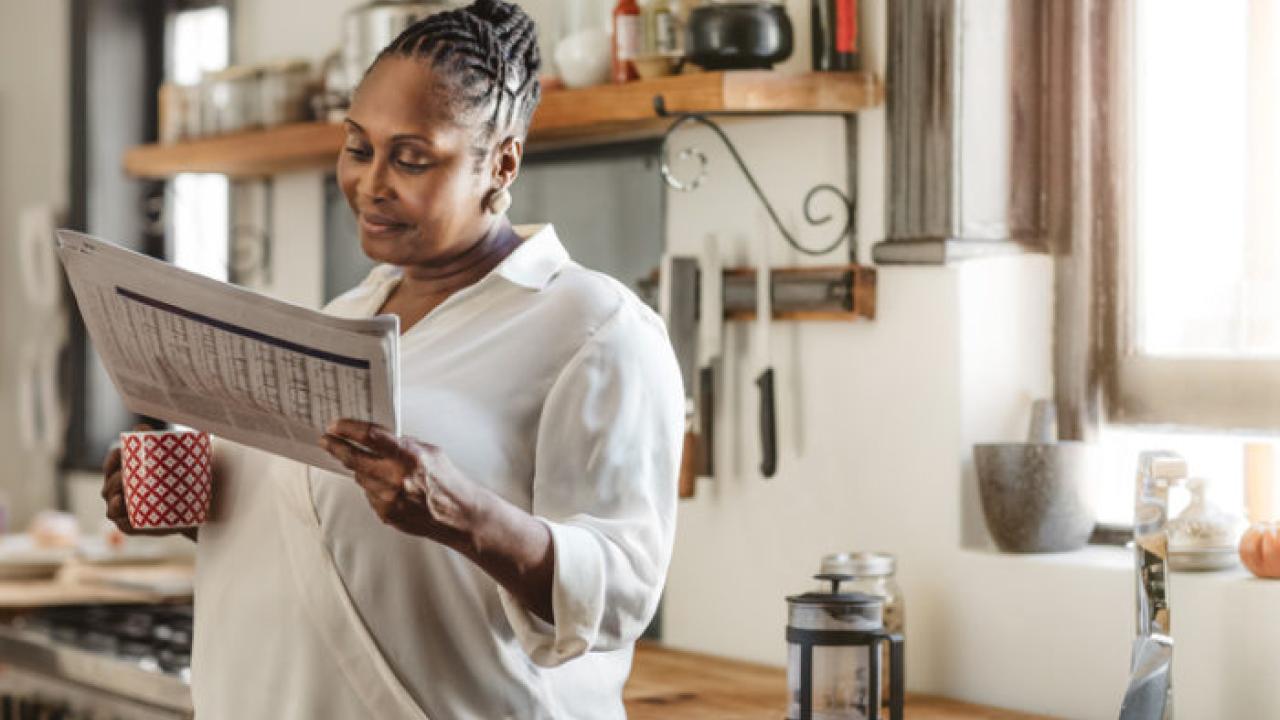 Woman reading newspaper