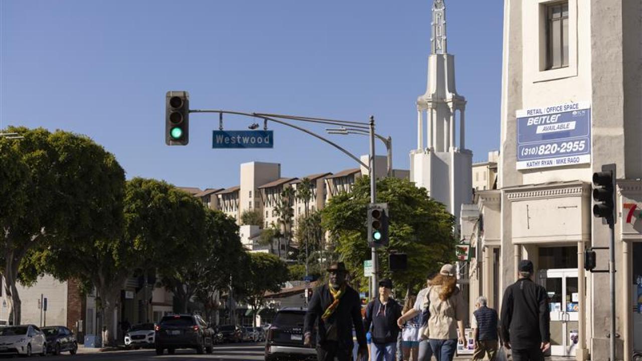 Pedestrians walk along westwood boulevard