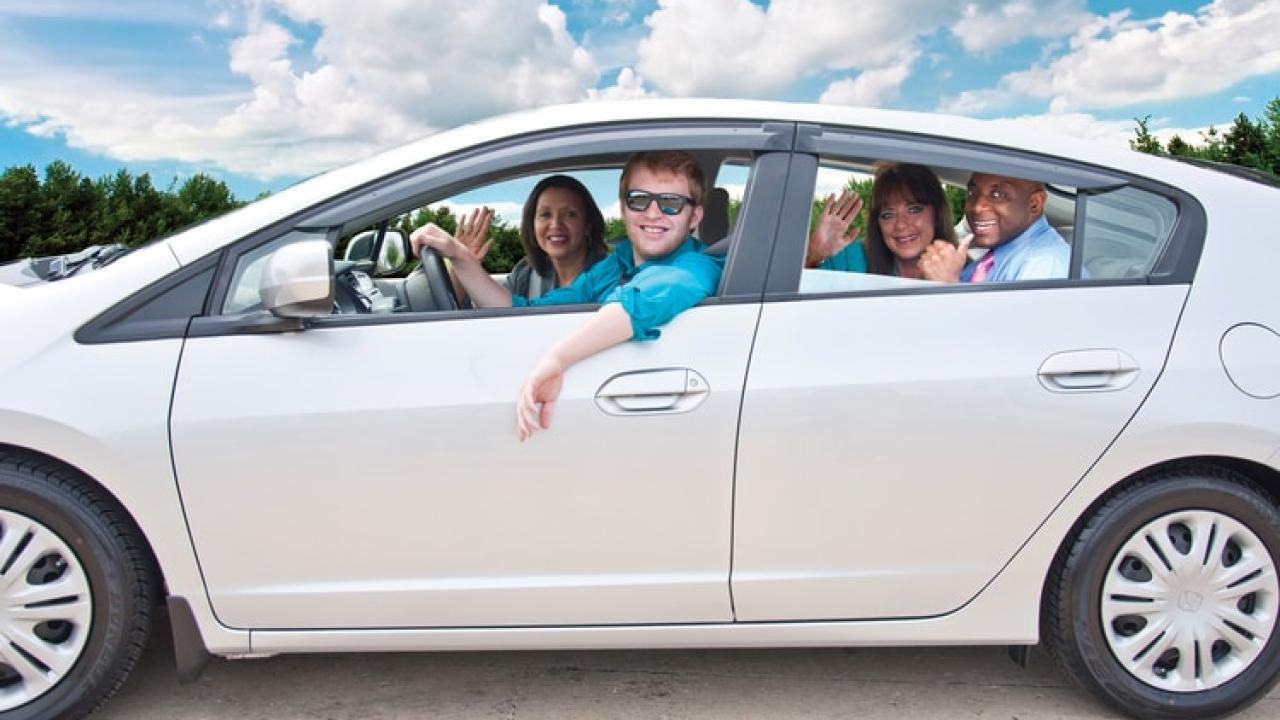 Happy employees carpooling together