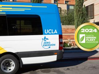 BruinAccess van next to the 2024 NAFA Green Fleet Award badge