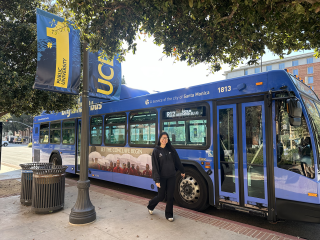 UCLA Rec employee in front of Big Blue Bus on campus