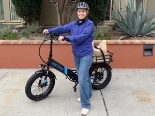 Magyn Kydd, senior director at UCLA Administration Marketing & Communications, with the e-bike she uses to commute to campus.