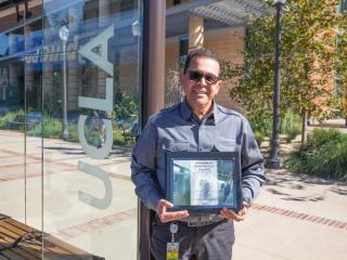 UCLA Transportation's Richard Jimenez Posing with Best Workplace Award