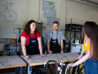 Nice UCLA Bike Shop staff assisting a Bruin bike rider.