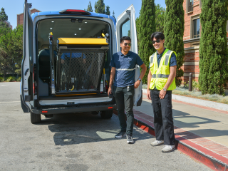 BruinAccess student employees operating wheelchair ramp