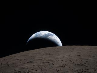 Earthset captured through the Orion spacecraft during the Artemis II crew’s flyby of the Moon.