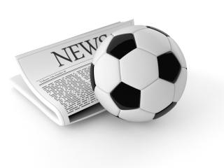 Newspaper with a soccer ball
