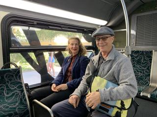 Married UCLA lecturers sitting on a bus