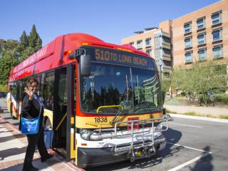 UCLA Health Employee Althea Nelson boards the Long Beach Transit bus